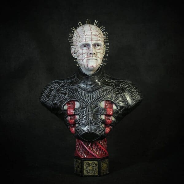 Horror character bust with pins and black attire.