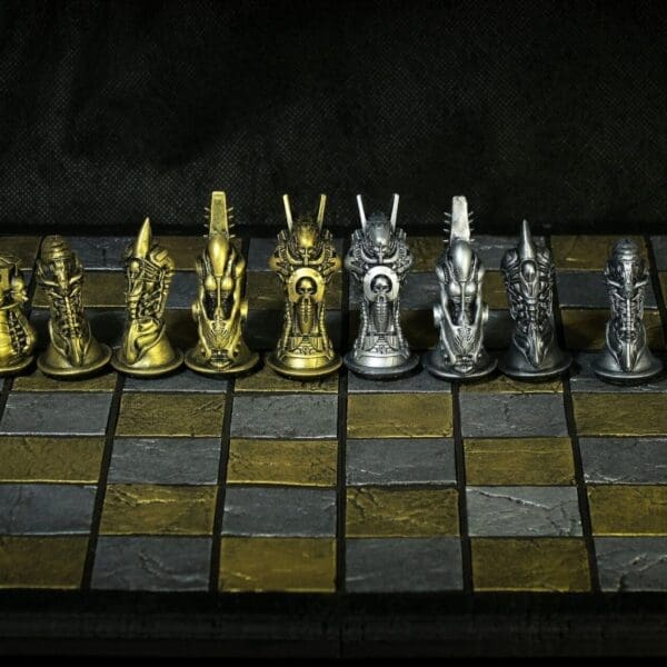 Ornate gold and silver chess pieces on board.