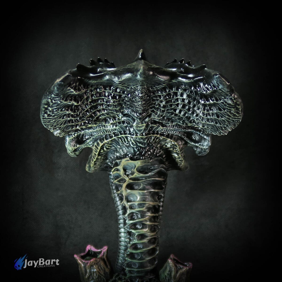 Alien Queen sculpture with textured, intricate details.