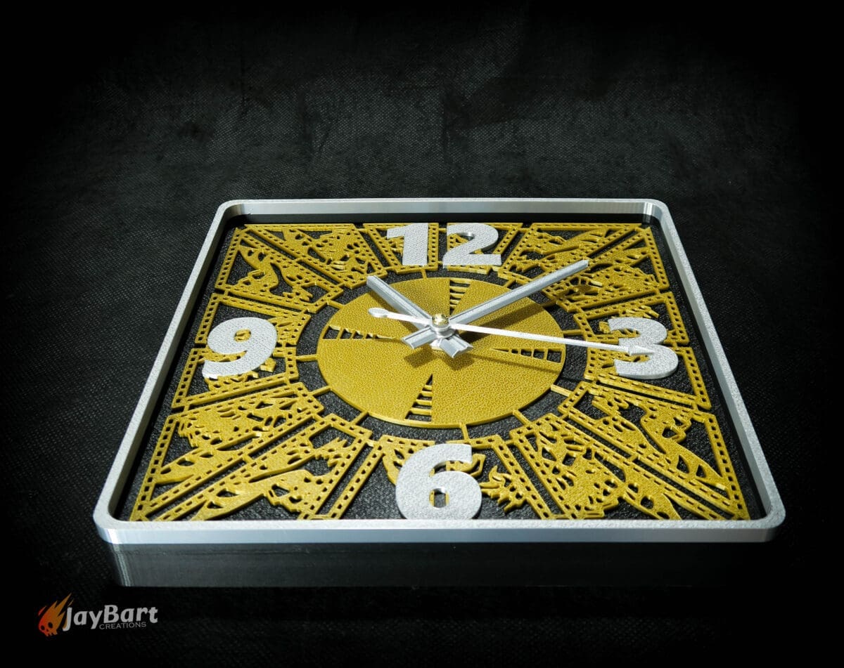 Gold and silver square decorative wall clock face.