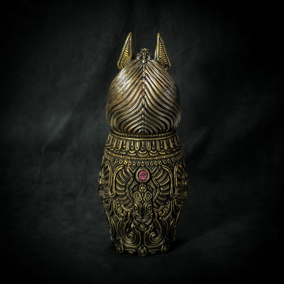 Intricate bronze cat statue with ornate details