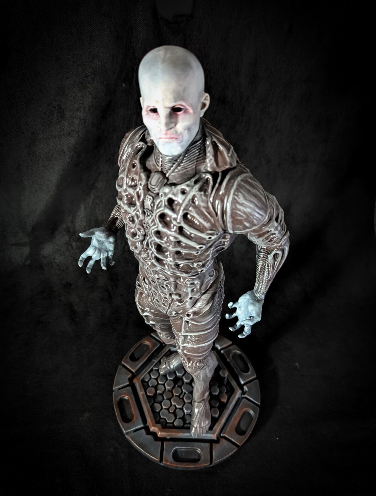 Detailed alien figure with intricate armor design.