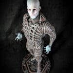 Detailed alien figure with intricate armor design.