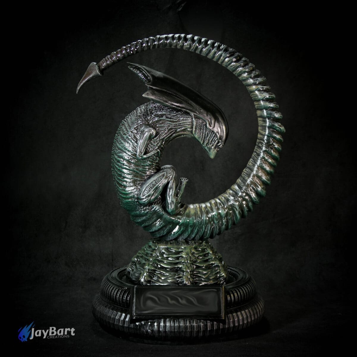 Intricate alien sculpture on rotating base.