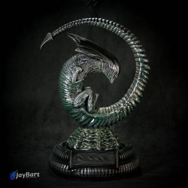 Intricate alien sculpture on rotating base.