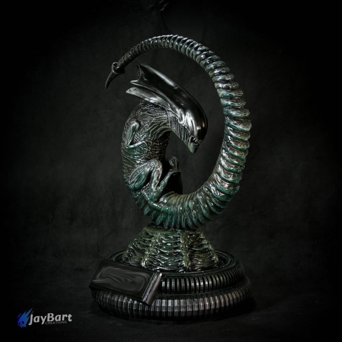 Alien creature sculpture in circular design