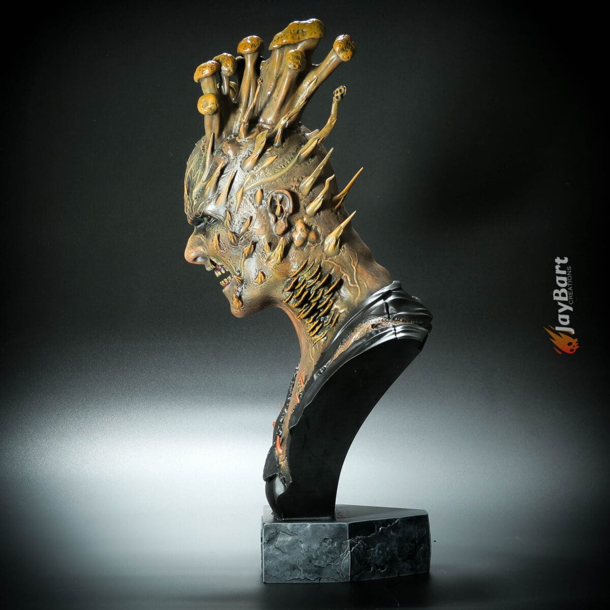 Fantasy sculpture with mushrooms and spikes on head.