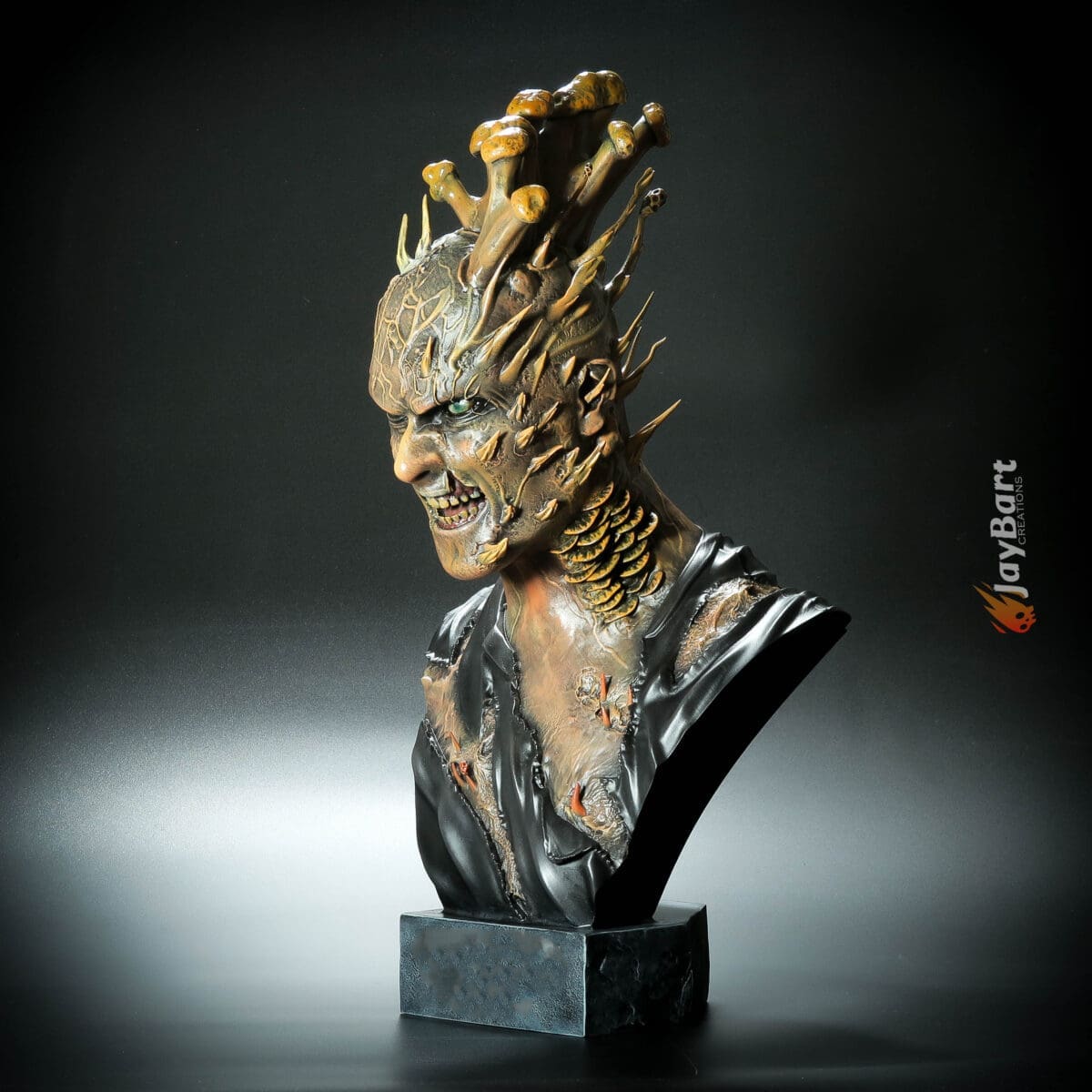 Detailed monster bust sculpture with horns and fangs.