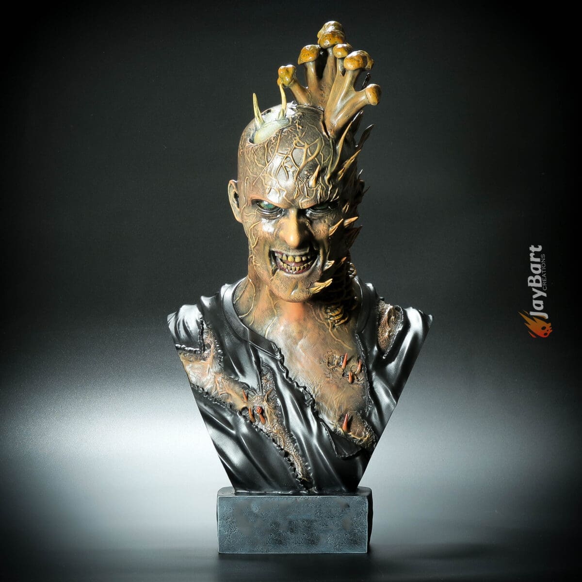 Fantasy monster bust sculpture with spikes and textures.