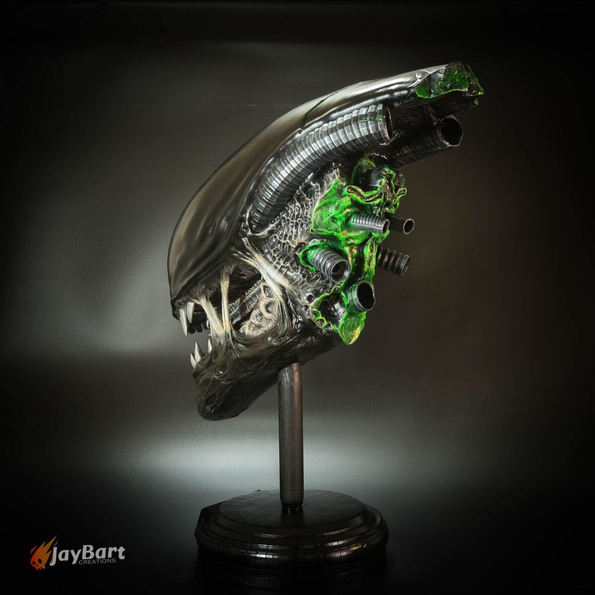 Futuristic alien sculpture with metallic and green details