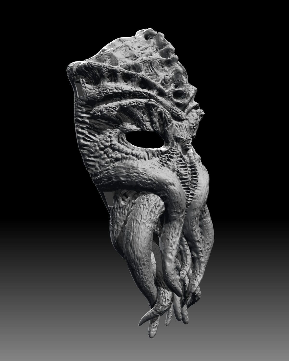 Intricate alien-like textured sculpture mask on display.