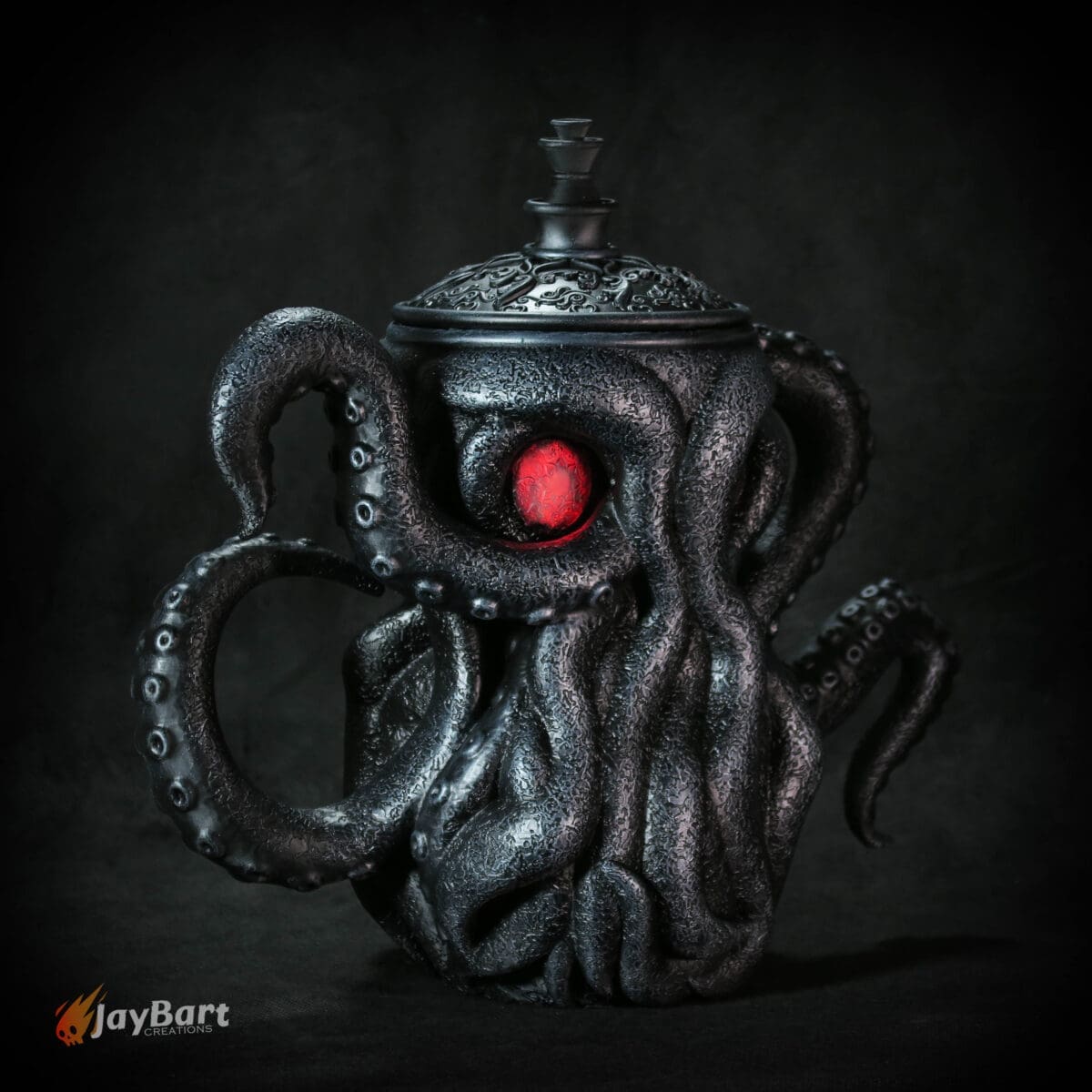 Octopus-themed teapot with red glowing eye.