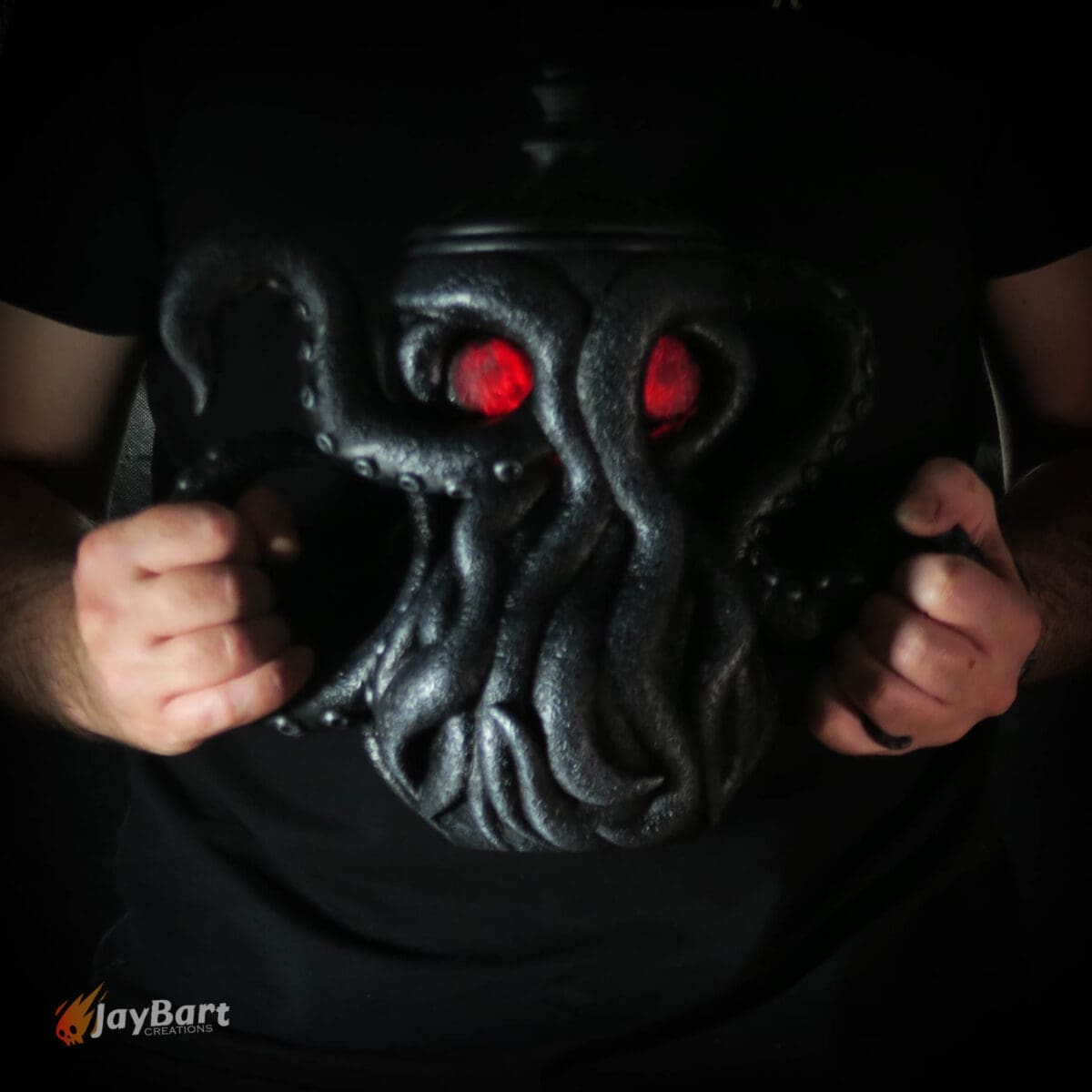 Dark octopus mug with glowing red eyes