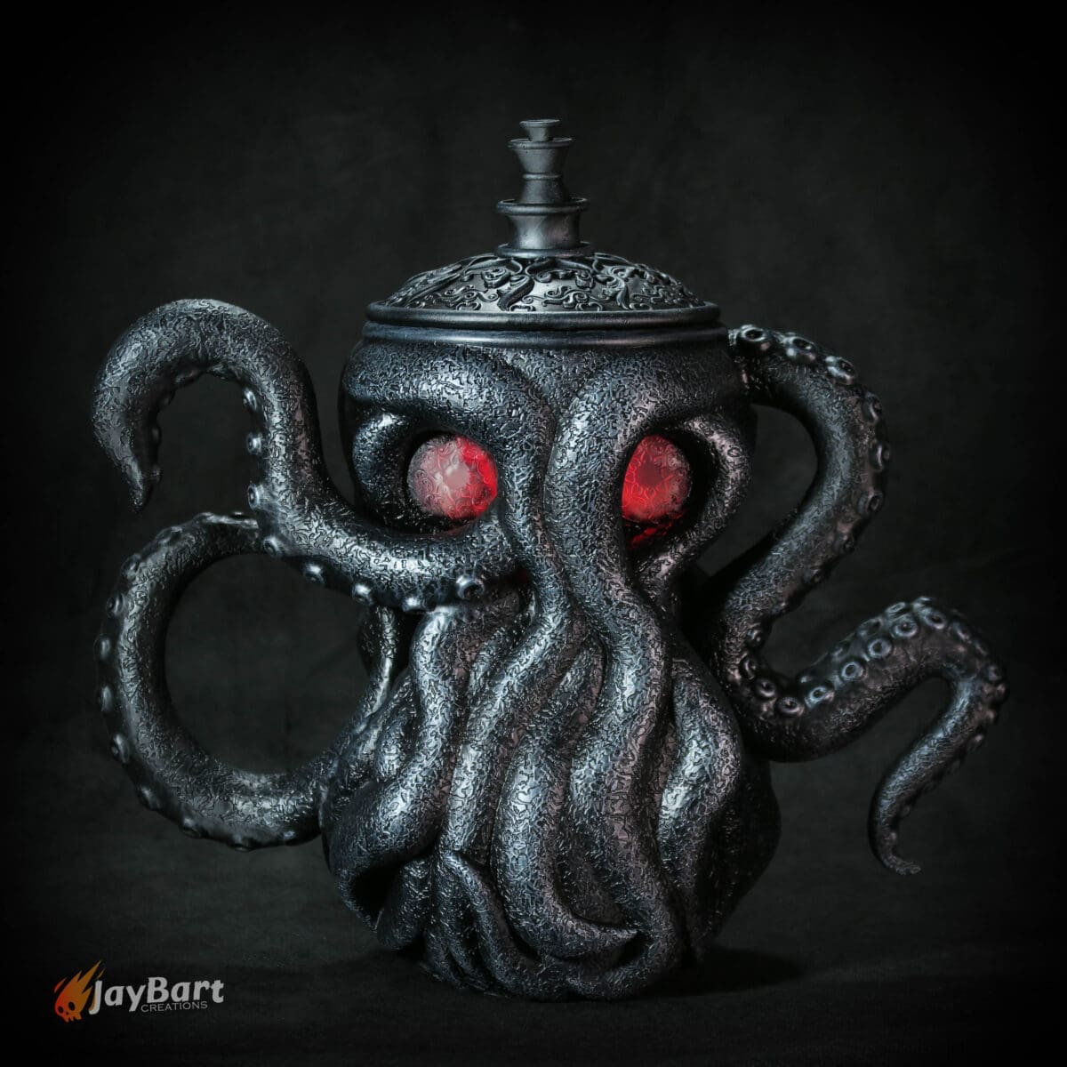 Octopus-themed teapot with red glowing eyes.