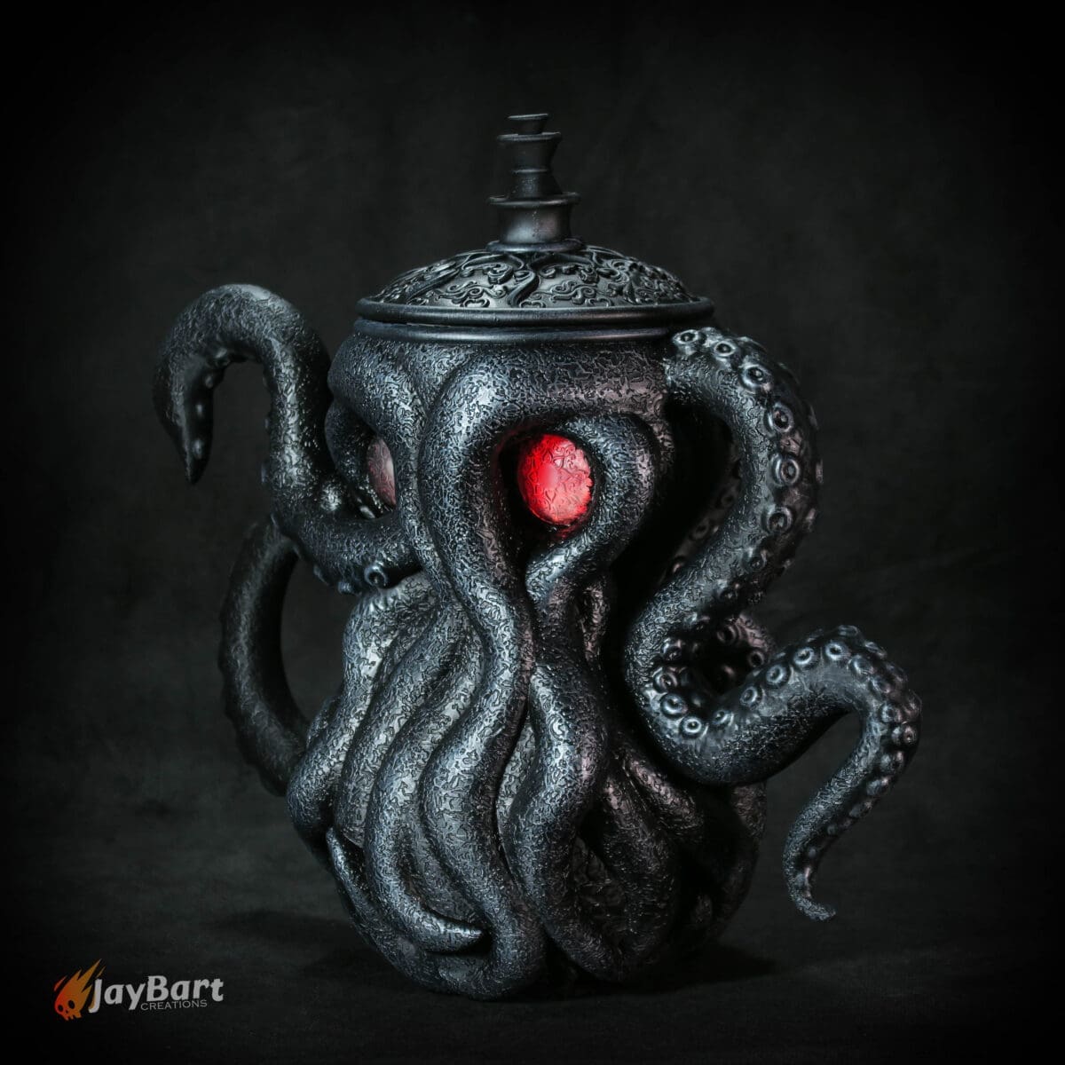 Cthulhu-themed black teapot with red eyes