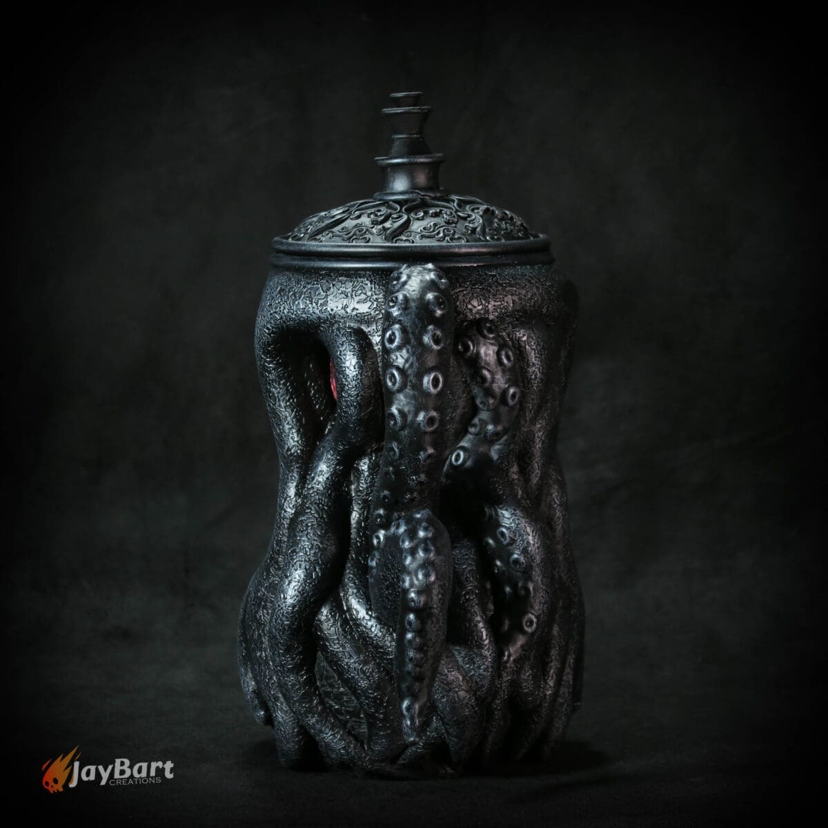 Intricate octopus-themed black decorative container.