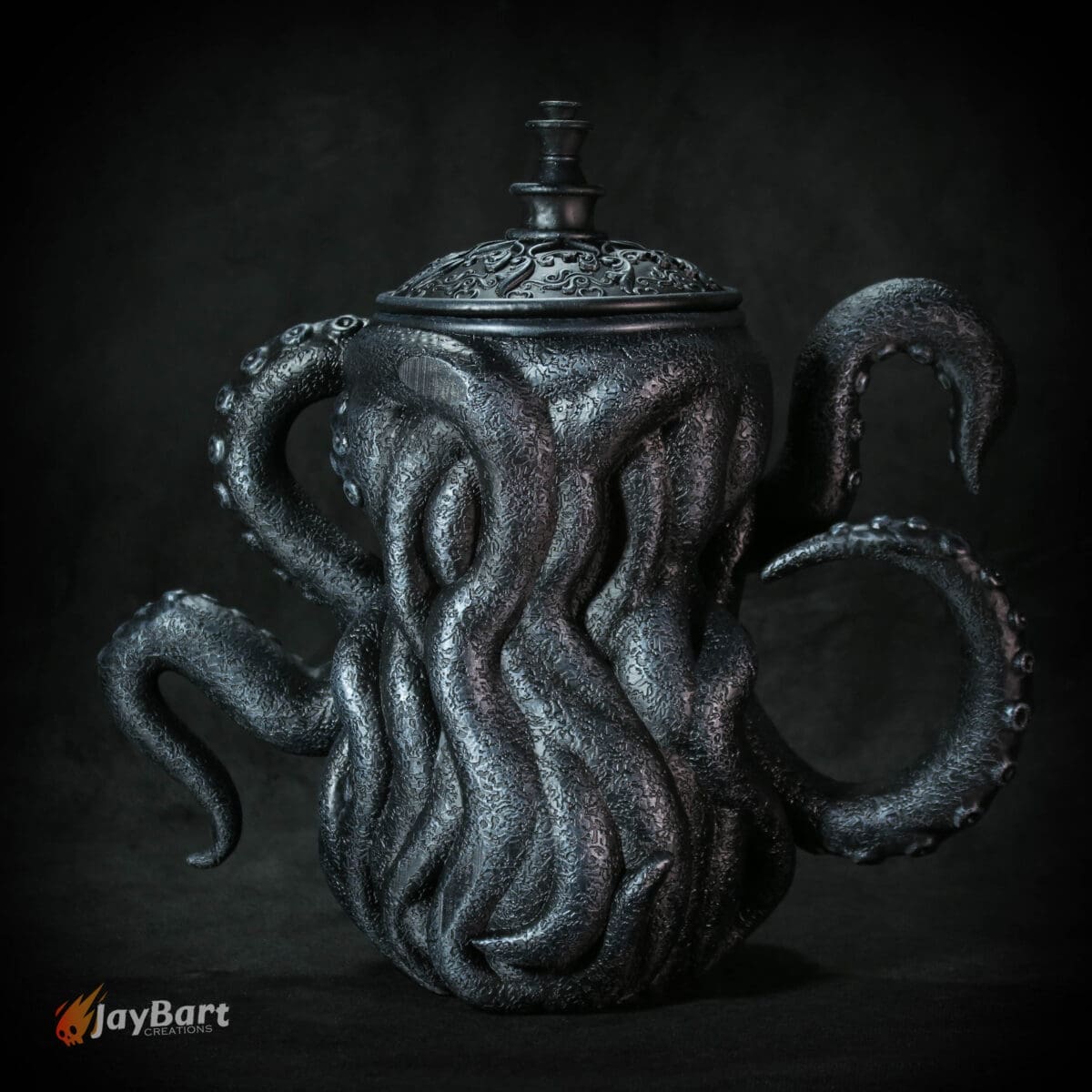 Octopus-themed teapot with detailed tentacles design.
